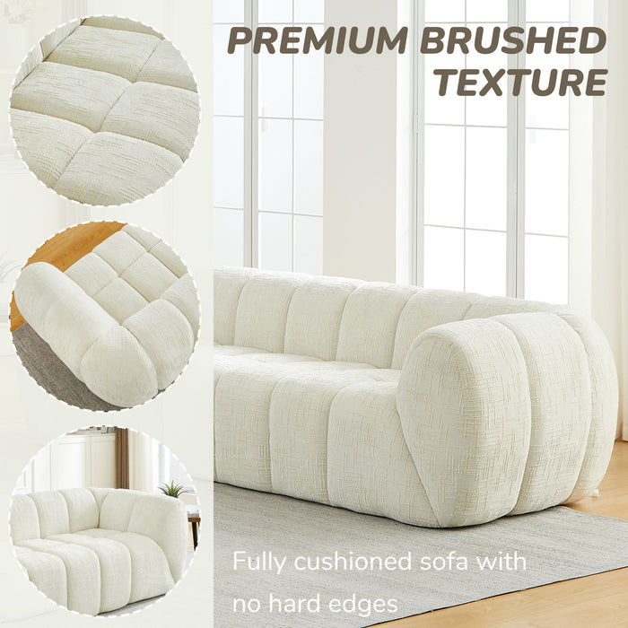 Quilted Cloud Sofa With Rounded Armrests And Piano Key Backrest Design