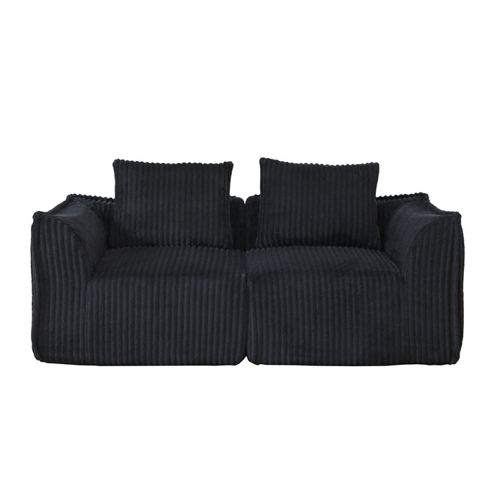 Minimalist Sofa With Curved Lines And Horn Shaped Throw Pillows