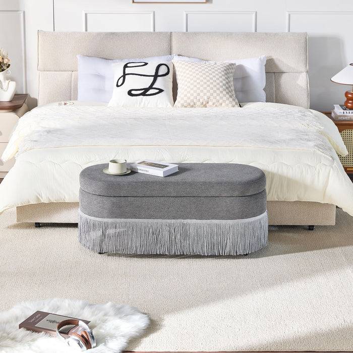 Oval Upholstered Storage Ottoman With Fringe Trim & Lift Top Lid