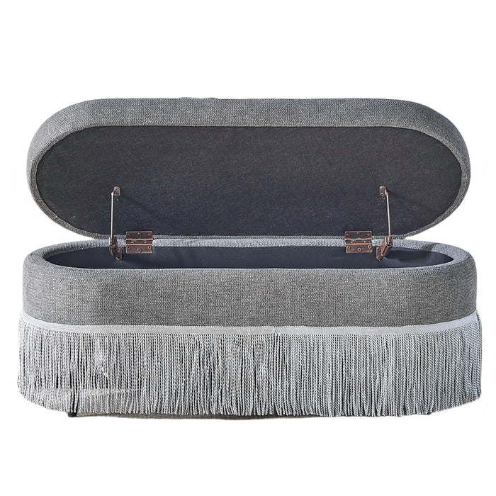 Oval Upholstered Storage Ottoman With Fringe Trim & Lift Top Lid