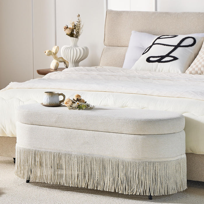 Oval Upholstered Storage Ottoman With Fringe Trim & Lift Top Lid