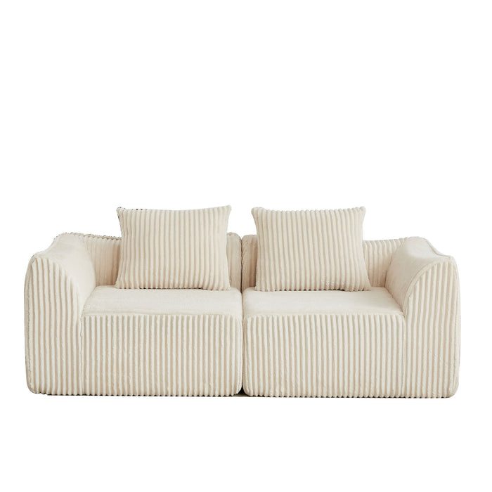 Minimalist Sofa With Curved Lines And Horn Shaped Throw Pillows