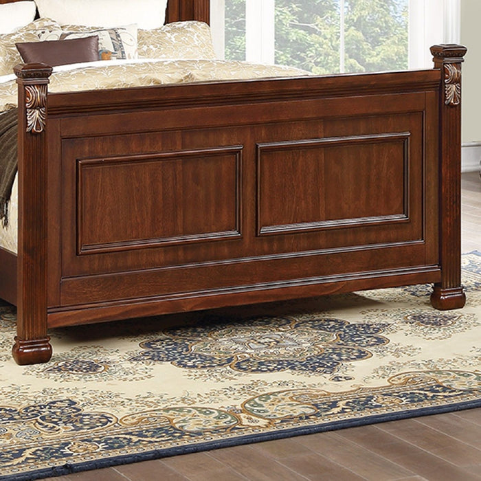 Bed With Ornate Carvings And Curved Headboard