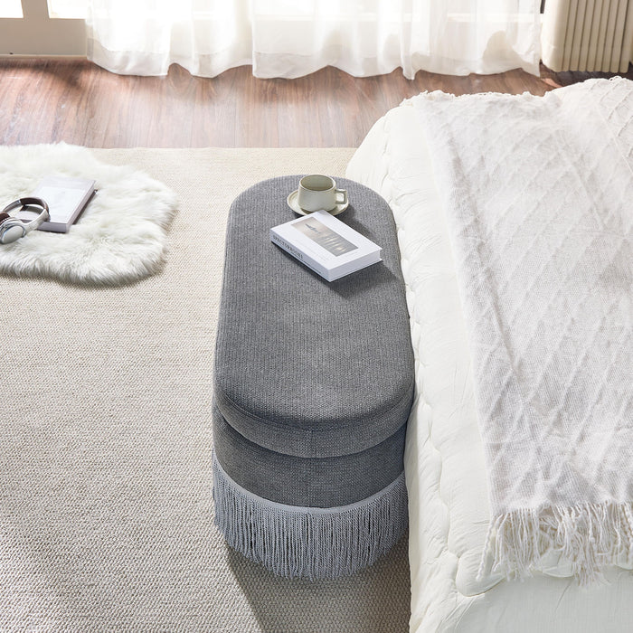 Oval Upholstered Storage Ottoman With Fringe Trim & Lift Top Lid
